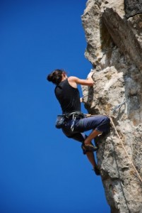 woman rock climbing