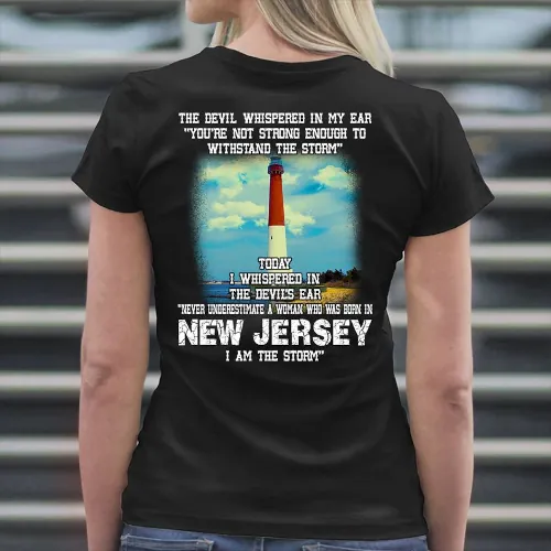 A picture of a blond woman wearing a black t-shirt that says, "The Devil whispered in my ear, 'you're not strong enough to withstand the storm.'  Below these words is a picture of the Cape May lighthouse.  And below the picture it says, "Today I whispered in the Devil's ear, 'Never underestimate a woman who was born in New Jersey.  I am the storm.'"