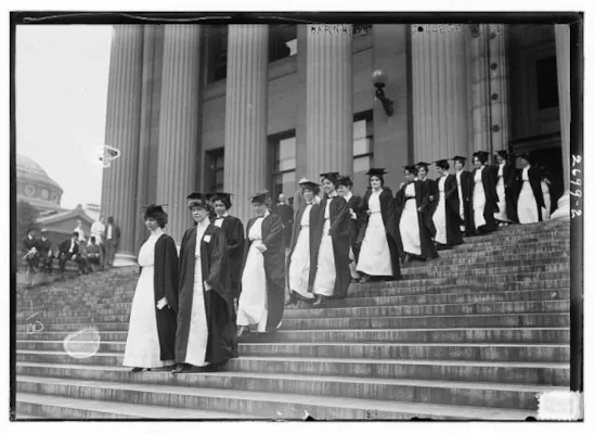 Women graduates in early 20th century walking down the steps of a women's university building